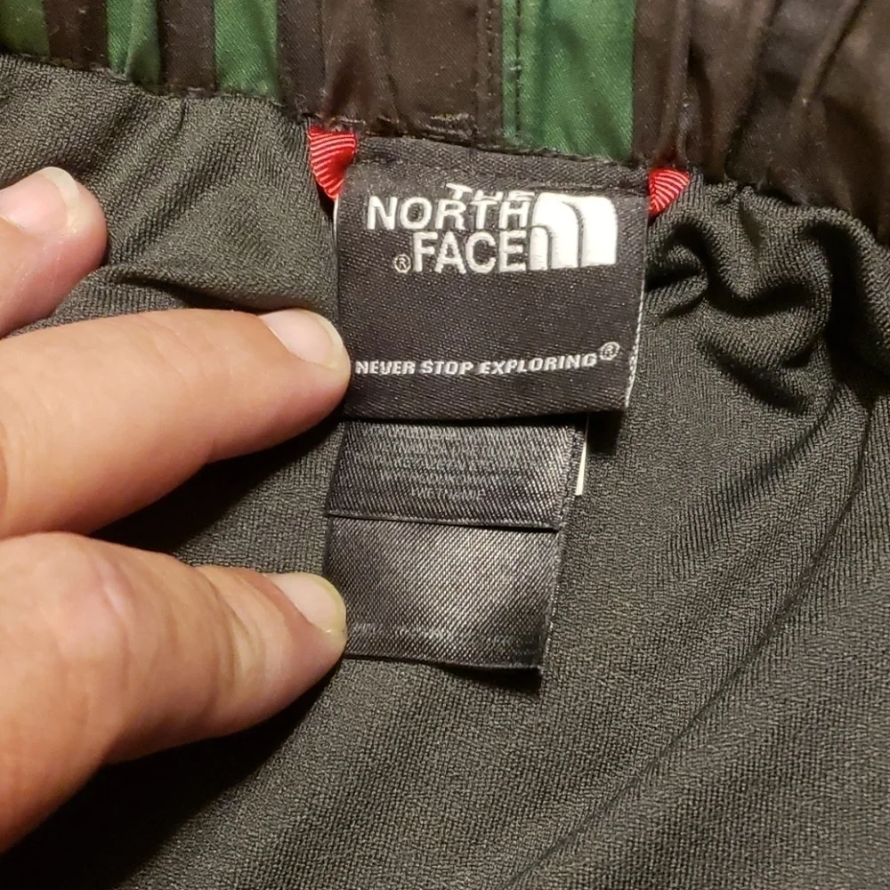 The north face green and gray lined swim trunks